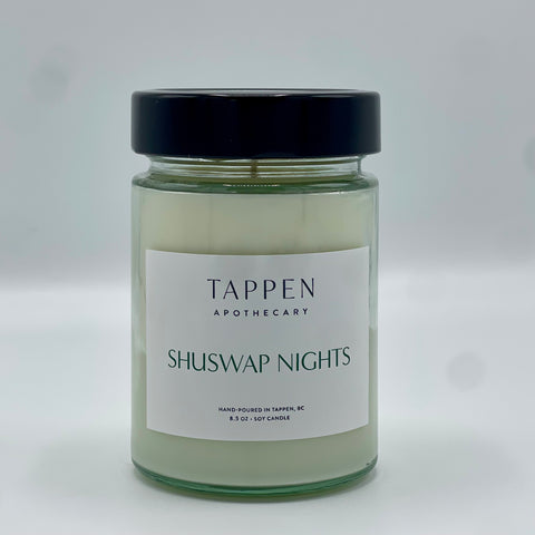 Candle jar labeled 'Tappen Apothecary Shuswap Nights' on a white background